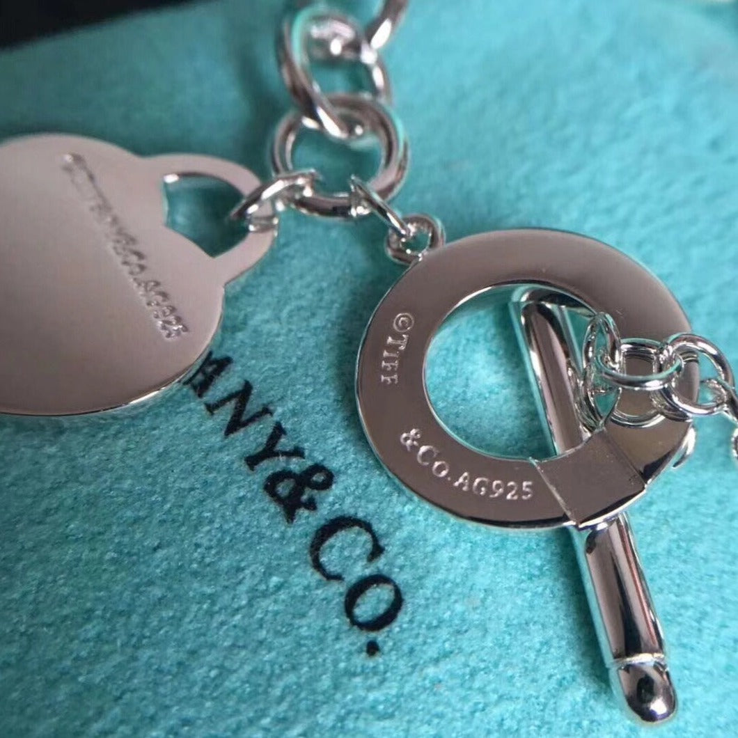 {
"Resenly Jewelry": "Resenly Jewelry",
"LOVE HEART PIN BUCKLE RETURN TO TIF SILVER BRACELET": "リターントゥティファニー ラブハート ピンバックル シルバーブレスレット"
}