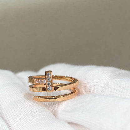 {
  "Resenly Jewelry": "レゼンリー・ジュエリー",
  "T WIRE DOUBLE ROWS RING PINK GOLD": "Tワイヤー ダブルロウ リング ピンクゴールド"
}