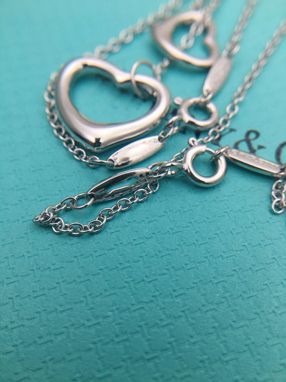 {
  "Resenly Jewelry": "Resenly Jewelry",
  "OPEN HEART SILVER NECKLACE": "オープンハート シルバーネックレス"
}