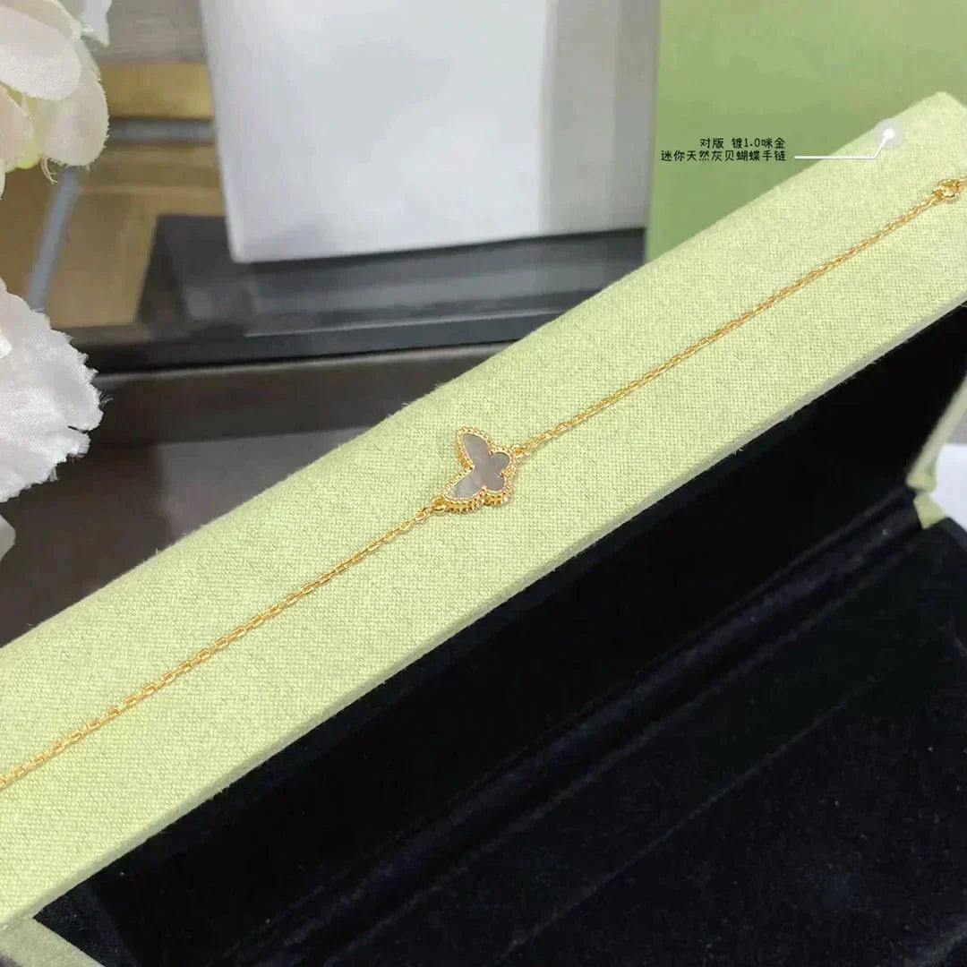 {
  "Resenly Jewelry": "Resenly Jewelry",
  "BUTTERFLY DARK MOP BUTTERFLY BRACELET": "バタフライ ダークMOP バタフライ ブレスレット"
}
