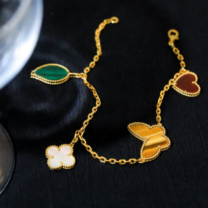 {
  "Resenly Jewelry": "レゼンリー・ジュエリー",
  "LUCKY SPRING 5 MOTIF GOLD BRACELET": "ラッキースプリング 5モチーフ ゴールドブレスレット"
}