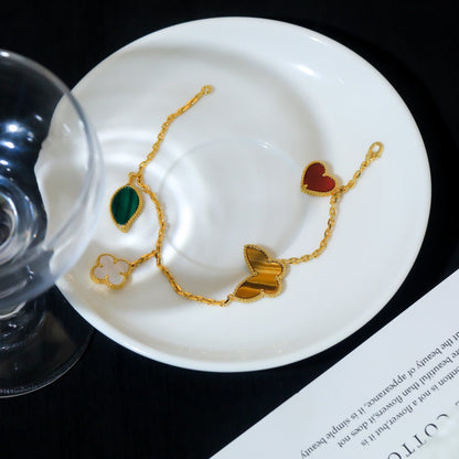{
  "Resenly Jewelry": "レゼンリー・ジュエリー",
  "LUCKY SPRING 5 MOTIF GOLD BRACELET": "ラッキースプリング 5モチーフ ゴールドブレスレット"
}