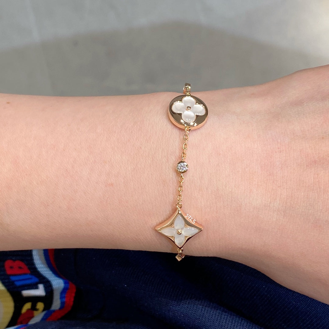 {
  "Resenly Jewelry": "Resenly Jewelry",
  "STAR AND SUN 4 MOTIF WHITE MOP PINK GOLD BRACELET": "スター＆サン 4モチーフ ホワイトMOP ピンクゴールドブレスレット"
}