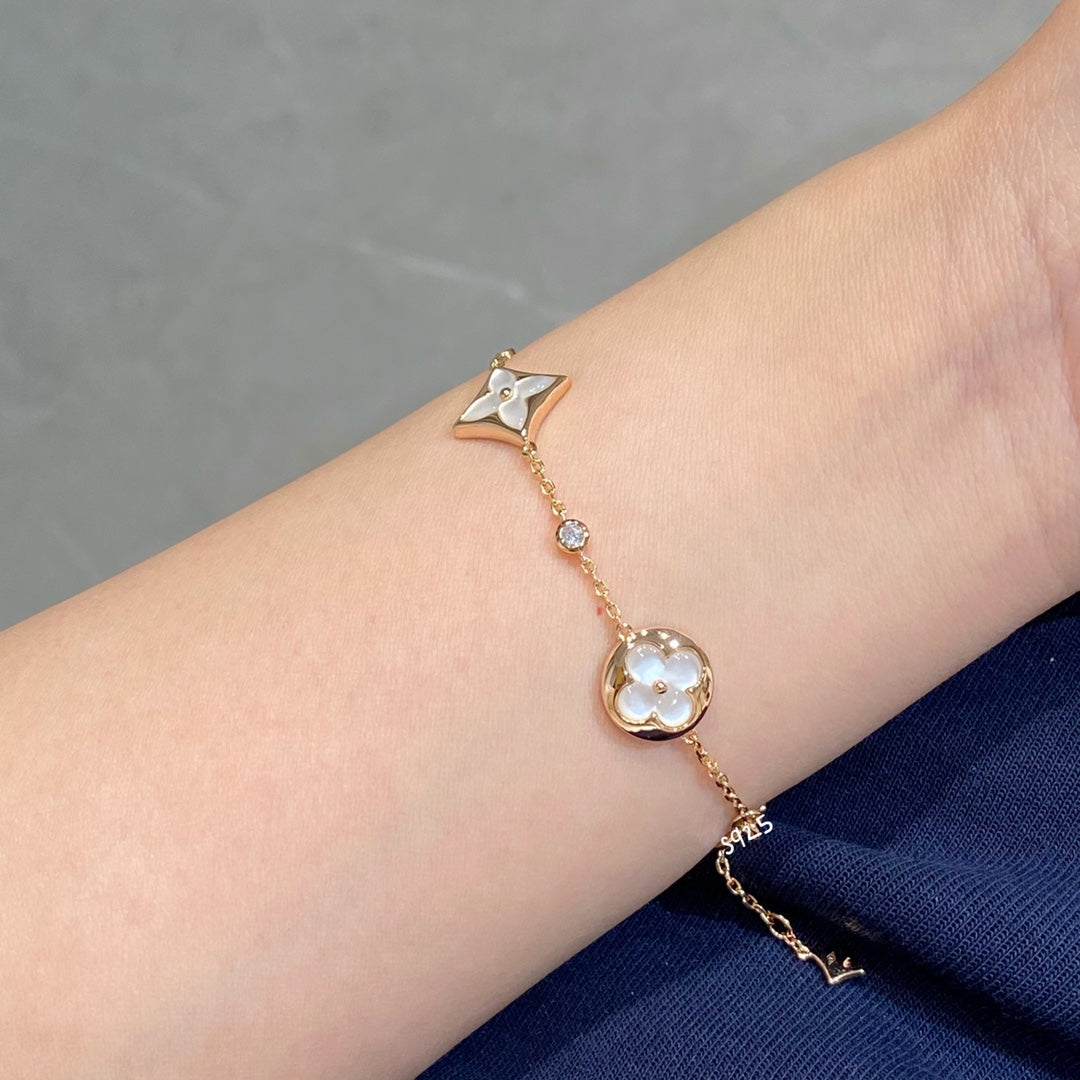 {
  "Resenly Jewelry": "Resenly Jewelry",
  "STAR AND SUN 4 MOTIF WHITE MOP PINK GOLD BRACELET": "スター＆サン 4モチーフ ホワイトMOP ピンクゴールドブレスレット"
}
