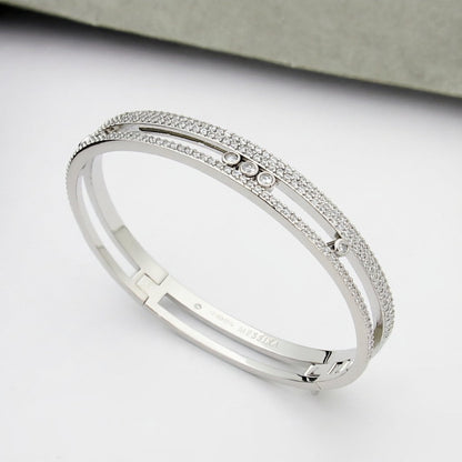 {
  "Resenly Jewelry": "レゼンリー・ジュエリー",
  "Move Romane pavé bangle": "ムーヴ ロマーヌ パヴェ バングル"
}