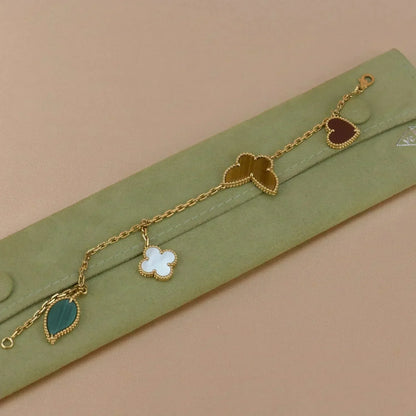 {
  "Resenly Jewelry": "レゼンリー・ジュエリー",
  "LUCKY SPRING 5 MOTIF GOLD BRACELET": "ラッキースプリング 5モチーフ ゴールドブレスレット"
}