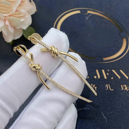 {
  "Resenly Jewelry": "Resenly Jewelry",
  "KNOT DROP EARRINGS IN YELLOW GOLD WITH DIAMONDS": "ノット ドロップ イヤリング（イエローゴールド、ダイヤモンド）"
}