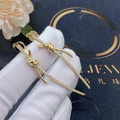 {
  "Resenly Jewelry": "Resenly Jewelry",
  "KNOT DROP EARRINGS IN YELLOW GOLD WITH DIAMONDS": "ノット ドロップ イヤリング（イエローゴールド、ダイヤモンド）"
}