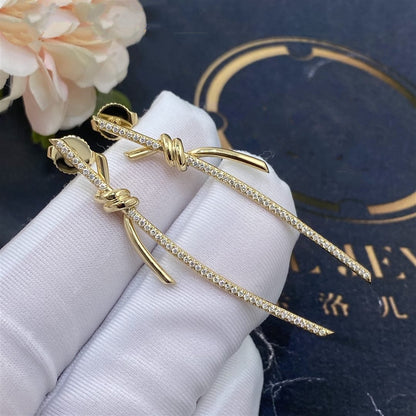{
  "Resenly Jewelry": "Resenly Jewelry",
  "KNOT DROP EARRINGS IN YELLOW GOLD WITH DIAMONDS": "ノット ドロップ イヤリング（イエローゴールド、ダイヤモンド）"
}