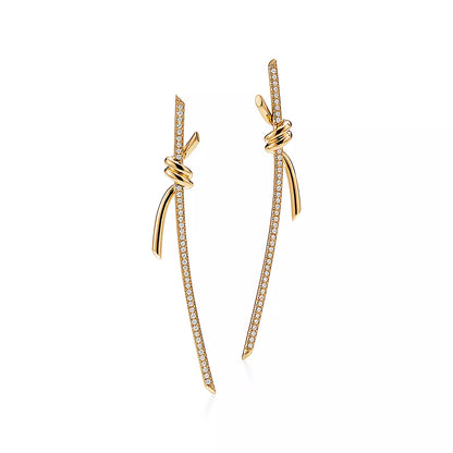 {
  "Resenly Jewelry": "Resenly Jewelry",
  "KNOT DROP EARRINGS IN YELLOW GOLD WITH DIAMONDS": "ノット ドロップ イヤリング（イエローゴールド、ダイヤモンド）"
}