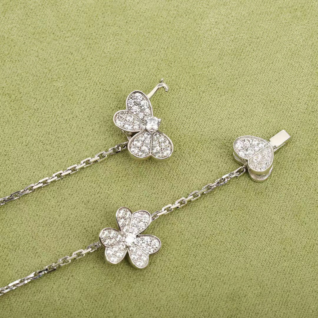 {
  "Resenly Jewelry": "Resenly Jewelry",
  "FRIVOLE SILVER 9 FLOWERS NECKLACE": "フリヴォル シルバー 9フラワー ネックレス"
}